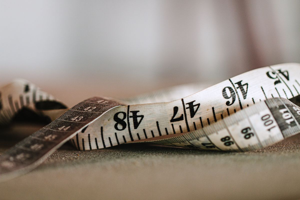 Close-up of a tape measure showing precise centimetre markings